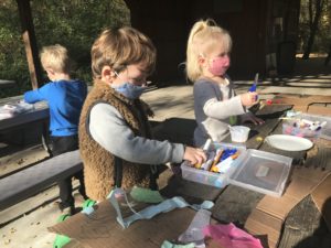 The Bear Room at Coddington enjoys preschool craft projects outside