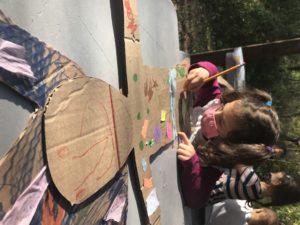 Bear Room doing arts and crafts in their outdoor classroom