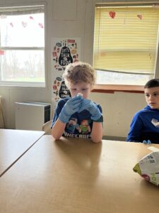 A photograph of a child enjoying a presentation at the Coddington Road Community Center on brains 