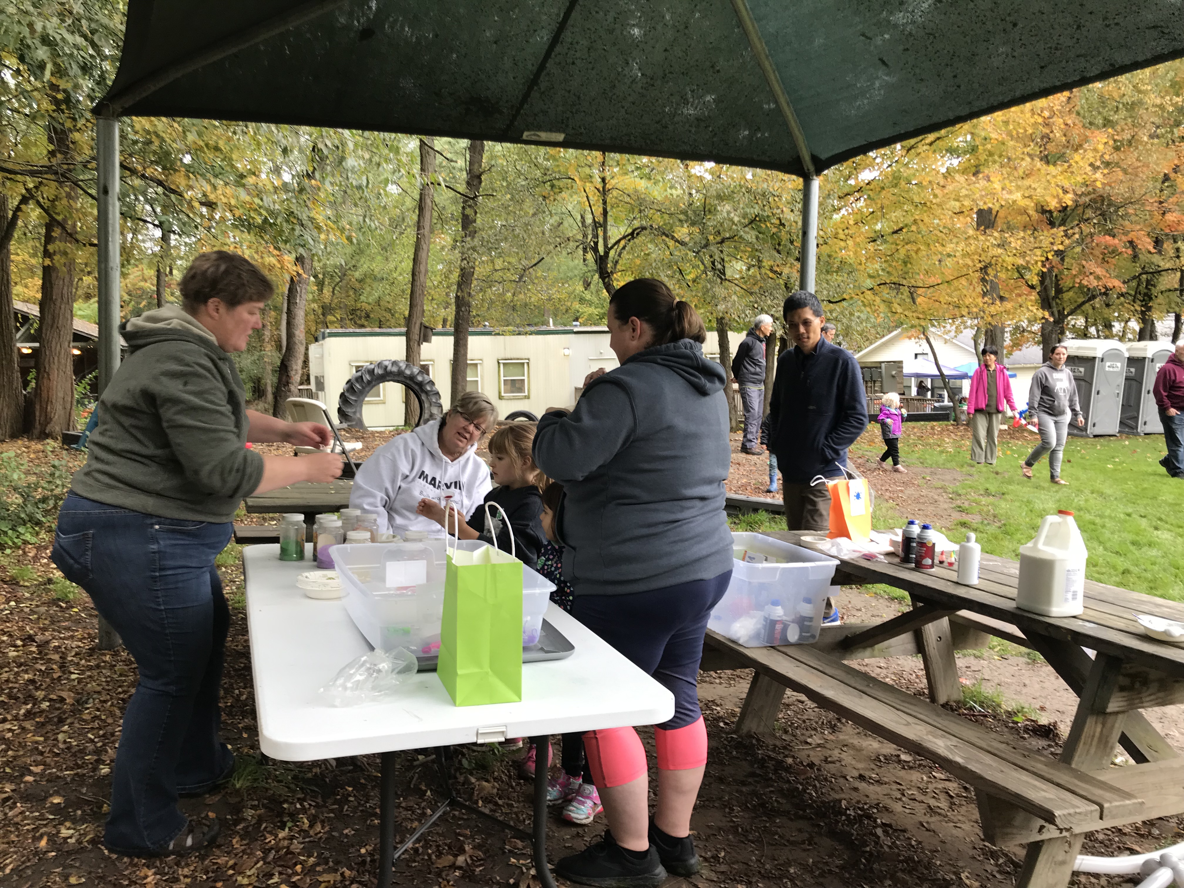 Slime making and sand art activity table at the Coddington Road Community Center in Ithaca, NY for our annual Fall Festival
